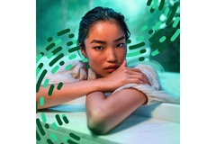 Image A woman wearing clothing made from a probiotic textile by the company HeiQ.