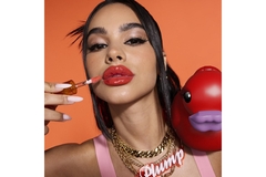Image A woman modeling wearing Duck Plump Extreme Sensation Pumping Gloss by NYX Professional Makeup.