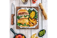 Image Table of processed foods, burgers and fries.