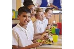 Image Children having school lunch.