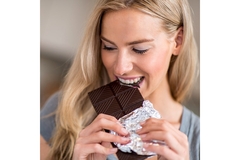 Woman eating chocolate.