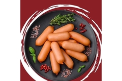 Image Processed meat product is put on a white plate.