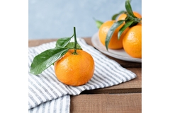 Image Oranges on a wooden table.