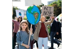 Image People demonstrating for climate change, holding up signs.