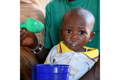 Image Children receive a nutritious meal at the CSPS Health Center, in Fada, in the east of Burkina Faso.