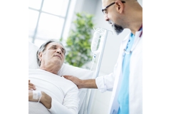 Image Doctor treating patient in hospital.