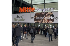 Image Visitors entering trade show building.