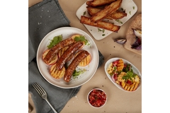 Cultivated meat is placed on a dish of different kinds of food.