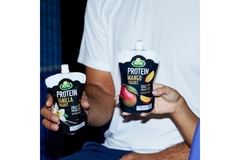 Image Two hands holding Arla yogurt.