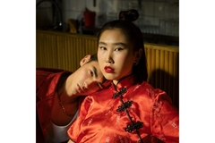 Image An Asian man resting his head on an Asian woman's shoulder.
