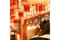 Image A Chinese food market filled with warm food during Chinese New Year.