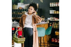 A pregnant women shopping in a health food store.
