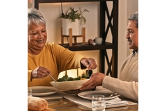 Image Man and woman eating a healthy meal.