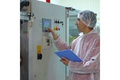 Image Worker in a factory doing a quality control test.