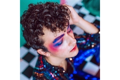 Man wearing colorful makeup
