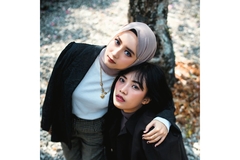 Image Photo Of hijabi woman Hugging asian woman.