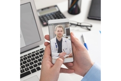 Image Person talkin to their doctor on a mobile phone.