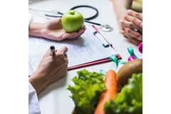 Image Doctor giving advice on nutrition, holding an apple above a document.