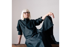 Image old woman with bob and glasses poses