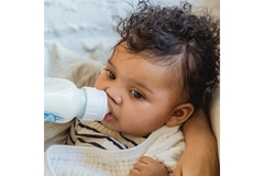 Image Baby drinking formula.