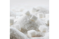 Image Sugar cubes on a pile of sugar.