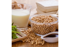 Image Soybeans and soy milk in a glass.