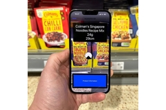 Image person scanning qr code on a unilever colman noodle pack