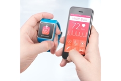 Image Person linking their phone with smartwatch after workout.