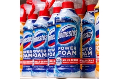 Domestos foam cleaning product on the shelf.