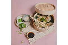 Meatable dumplings are placed on a table.