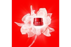 Image SK-II product package put over a graphic image of flower