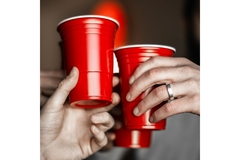 Image Hands holding paper-based beverage cups.