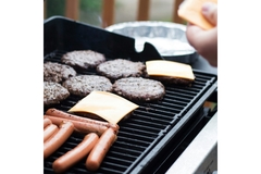 Image Beef is grilled under pieces of cheese.