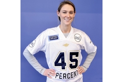 Image Kylie Kelce wearing a football jersey.