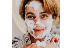 Image woman's face covered with foam