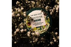 Image A products from The Body Shop surrounded by baby's breath.