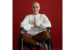 Cancer patient sitting in a wheelchair.