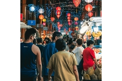 Image People walk on food market during spring festival.
