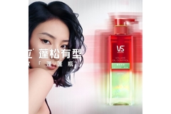 Image Woman poses next to shampoo bottle