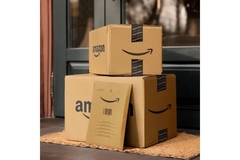 Amazon boxes in front of a house.