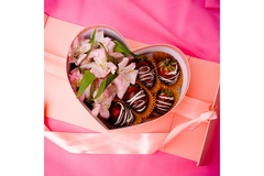 Image a heart shaped box filled with chocolate covered strawberries