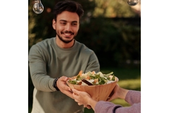 Image Man takes salad smiling