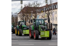 Image German farmers protesting on tractors.