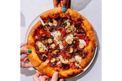 Image People are sharing a pizza.