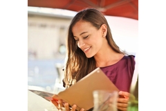 Image Woman looks at menu with healthy options