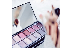 Image Beauty products are placed on a white table.