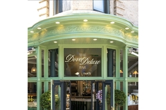 Image The outside of a bar with the Dove logo on it.
