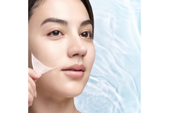 Image woman peels of veil from cheek