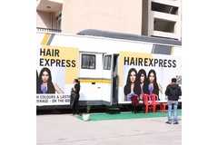 Image A caravan with Schwarzkopf branding all over it.