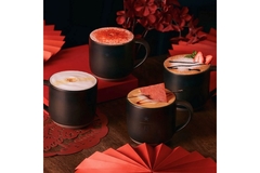 Image Four cups of Starbucks pork-flavored coffee with pork pieces on top.